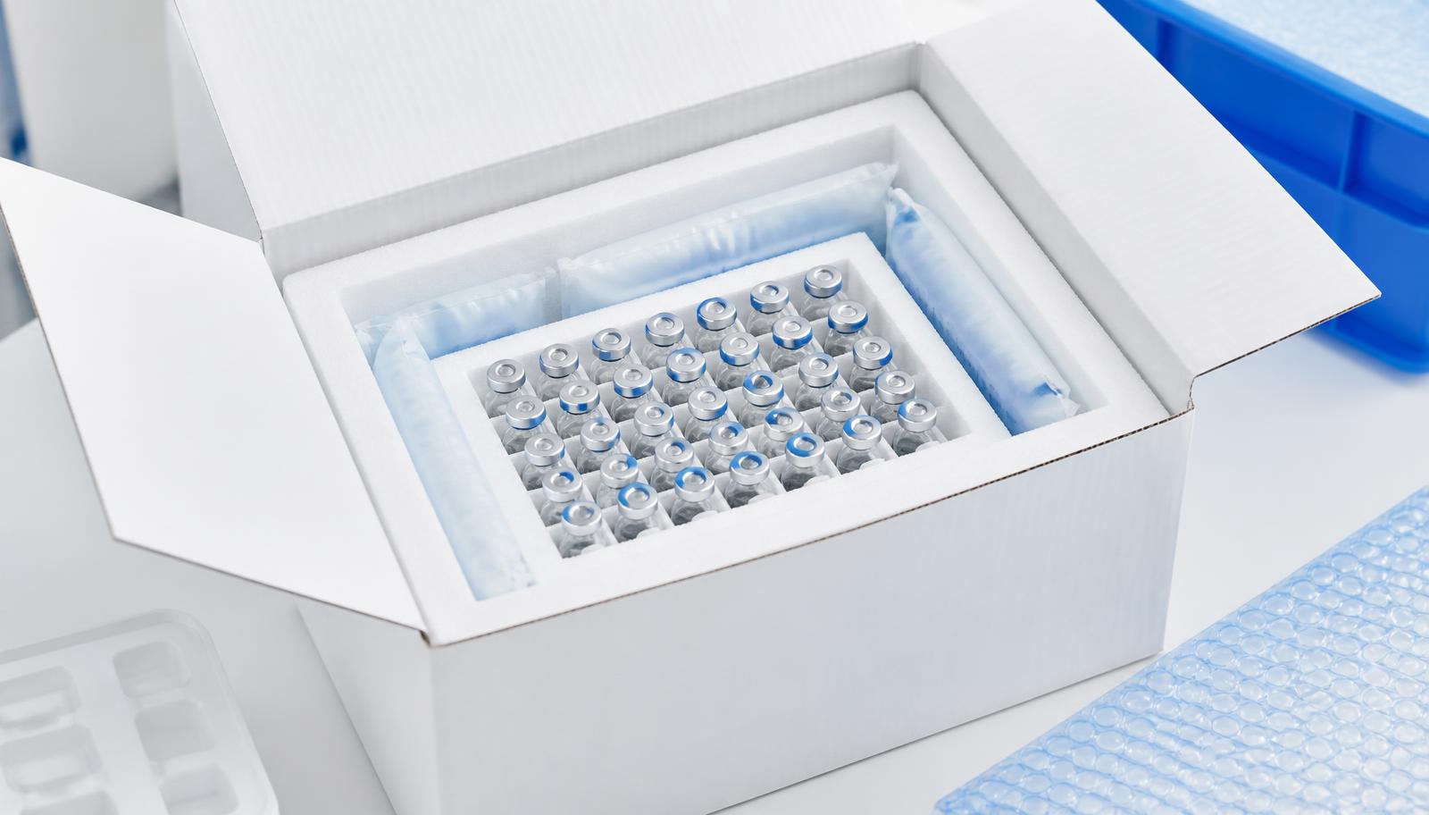 Insulated shipping box packed with vials and frozen gel packs
