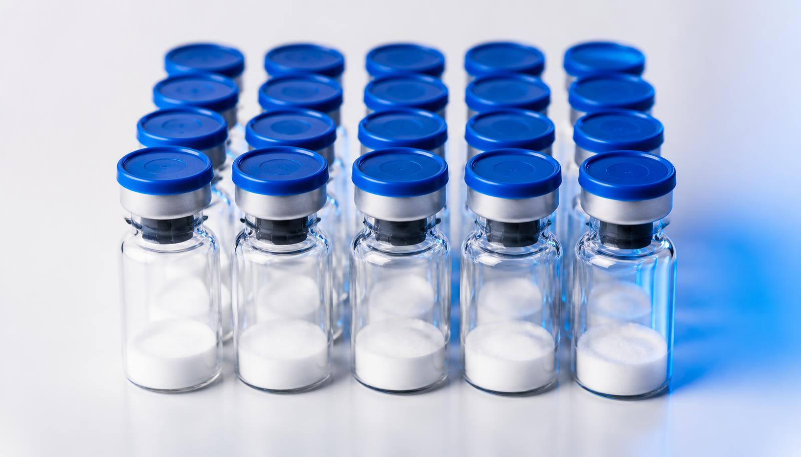 Research peptide vials arranged on a clean lab surface